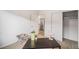 Minimalist bedroom design with neutral carpet, desk, and plenty of closet space at 1300 N Ogden St # 204, Denver, CO 80218