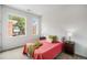 Bedroom boasts natural light, soft carpet, and a cozy atmosphere at 1300 N Ogden St # 204, Denver, CO 80218