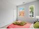 Sunny bedroom with views, soft carpet, and neutral decor at 1300 N Ogden St # 204, Denver, CO 80218