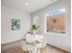 Cozy dining area boasts a modern table, bright lighting, and comfortable seating for intimate gatherings at 1300 N Ogden St # 204, Denver, CO 80218