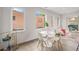 Bright dining room showcases a modern table, stylish chairs, and plenty of natural light at 1300 N Ogden St # 204, Denver, CO 80218