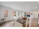 Bright kitchen boasts natural light, island with sink, and a view of the outdoor space at 1300 N Ogden St # 204, Denver, CO 80218