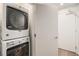 Stacked washer and dryer set with white doors at 1300 N Ogden St # 204, Denver, CO 80218