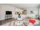 Stylish living area features open layout, hardwood floors, a modern kitchen, and comfortable furniture at 1300 N Ogden St # 204, Denver, CO 80218