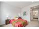 Comfortable bedroom with carpet, nightstands, and bathroom entrance at 1300 N Ogden St # 204, Denver, CO 80218