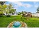 Backyard featuring a lawn, a playset, and a green turtle shaped sandbox at 8918 W 101St Ave, Broomfield, CO 80021