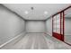 Unfinished basement features new carpet, lighting, and mirrored closet doors at 8918 W 101St Ave, Broomfield, CO 80021