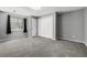 Spacious basement with plush gray carpet, ample closet space, and natural light at 8918 W 101St Ave, Broomfield, CO 80021