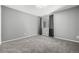 Cozy carpeted bedroom showcasing a window with blinds and neutral colored walls at 8918 W 101St Ave, Broomfield, CO 80021