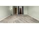Bedroom with neutral walls, carpeted floor, a standard closet, and two standard doors at 8918 W 101St Ave, Broomfield, CO 80021
