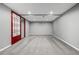 Spacious carpeted bedroom featuring recessed lighting, neutral walls, and a red sliding door at 8918 W 101St Ave, Broomfield, CO 80021