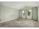 Bedroom features a neutral color scheme, a vaulted ceiling, carpeted floors, and two windows with curtains at 8918 W 101St Ave, Broomfield, CO 80021
