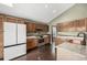 Well-lit kitchen featuring wood cabinets, granite countertops, stainless appliances, and a copper sink at 8918 W 101St Ave, Broomfield, CO 80021