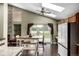 Well-lit kitchen with skylights, wood cabinets, stainless steel appliances, and a sliding glass door to the backyard at 8918 W 101St Ave, Broomfield, CO 80021