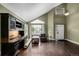 Well-lit living room featuring high ceilings, hardwood floors, and a large window at 8918 W 101St Ave, Broomfield, CO 80021