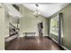 Bright living room with high ceilings, hardwood floors, and staircase to the second floor at 8918 W 101St Ave, Broomfield, CO 80021