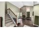 Inviting living room with a stone fireplace, hardwood floors, and a staircase at 8918 W 101St Ave, Broomfield, CO 80021