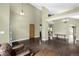 Open-concept living room with hardwood floors, high ceilings, and stylish light fixtures at 8918 W 101St Ave, Broomfield, CO 80021