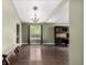 Spacious living room with hardwood floors, stylish light fixtures, and custom built-in desk at 8918 W 101St Ave, Broomfield, CO 80021