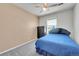 Bright bedroom features neutral walls, ceiling fan and comfortable carpet at 18947 E 57Th Pl, Denver, CO 80249