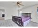 Bedroom with carpet, a black frame bed, and a window view at 18947 E 57Th Pl, Denver, CO 80249