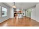 Dining area with hardwood floors, breakfast bar, and view of the kitchen at 18947 E 57Th Pl, Denver, CO 80249