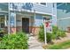 Close up view of the front of the house with a sign for HomeSmart Realty Group at 18947 E 57Th Pl, Denver, CO 80249