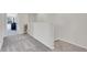 Upstairs hallway with gray carpet and access to bedrooms at 18947 E 57Th Pl, Denver, CO 80249