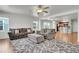 Cozy living room with plush seating, rug, open floor plan, and lots of natural light at 18947 E 57Th Pl, Denver, CO 80249