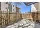 This private patio is fenced and features decorative rocks at 12143 Melody Dr # 104, Denver, CO 80234