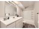 Fresh bathroom featuring a modern vanity, and a shower-tub combo at 12143 Melody Dr # 104, Denver, CO 80234