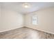 This bright bedroom features neutral paint tones and a window with blinds for privacy at 12143 Melody Dr # 104, Denver, CO 80234