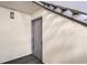 This entryway features a secure entry door and a carpeted hallway at 12143 Melody Dr # 104, Denver, CO 80234