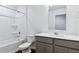 Clean, modern bathroom featuring a shower-tub combination, toilet, and vanity sink at 27424 E Byers Ave, Aurora, CO 80018