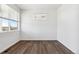 Bright bedroom with a large window providing natural light and beautiful outside views at 27424 E Byers Ave, Aurora, CO 80018