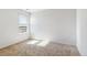Bedroom featuring neutral carpet and a window allowing natural light at 27424 E Byers Ave, Aurora, CO 80018