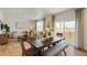 Dining room area with natural light, seating area, and backyard view at 27424 E Byers Ave, Aurora, CO 80018
