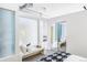 Modern bedroom with mirrored closet and built-in bench at 7700 E 29Th Ave # 411, Denver, CO 80238