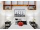 Bedroom with a bed, floating shelves, and southwestern decor at 7700 E 29Th Ave # 411, Denver, CO 80238