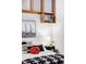 Bedroom with a bed, floating shelves, and southwestern decor at 7700 E 29Th Ave # 411, Denver, CO 80238