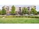Attractive exterior view of the community with well-maintained landscaping and street parking at 7700 E 29Th Ave # 411, Denver, CO 80238