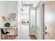 Hallway leading to a living space with art decor and view of other rooms at 7700 E 29Th Ave # 411, Denver, CO 80238