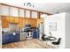 Modern kitchen with stainless steel appliances and blue cabinetry at 7700 E 29Th Ave # 411, Denver, CO 80238