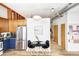 Modern kitchen with stainless steel appliances and a cozy breakfast nook at 7700 E 29Th Ave # 411, Denver, CO 80238