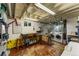 Functional basement featuring laundry area, workbench, and ample storage at 1410 S Ammons St, Lakewood, CO 80232