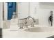 Close up of a modern bathroom sink and faucet with stylish soap dispenser at 1410 S Ammons St, Lakewood, CO 80232