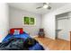 Simple bedroom featuring wood floors, a window with natural light, and closet at 1410 S Ammons St, Lakewood, CO 80232