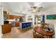 Eat-in kitchen featuring a blue island and updated appliances at 1410 S Ammons St, Lakewood, CO 80232