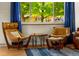 Cozy living area featuring large window and comfortable seating for relaxing and entertaining at 1410 S Ammons St, Lakewood, CO 80232