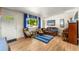 Inviting living room with hardwood floors, ample seating, and a bright, airy ambiance at 1410 S Ammons St, Lakewood, CO 80232